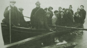 AOS P 1521 fen bridge flood early 1930s. a johnny brown at the oars of his boat